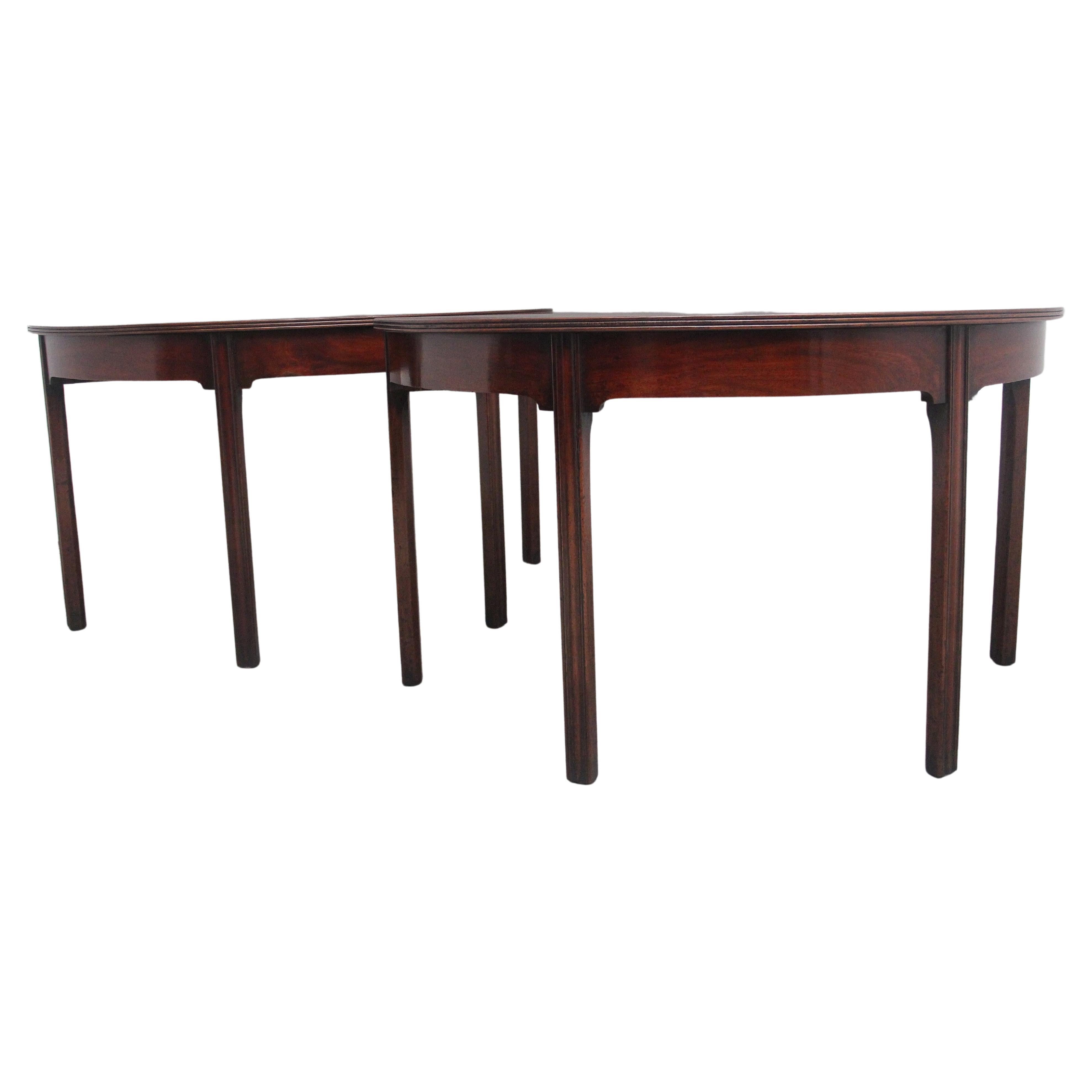 A fine pair of early 19th Century mahogany demilune console tables For