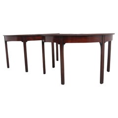 A fine pair of early 19th Century mahogany demi-lune console tables