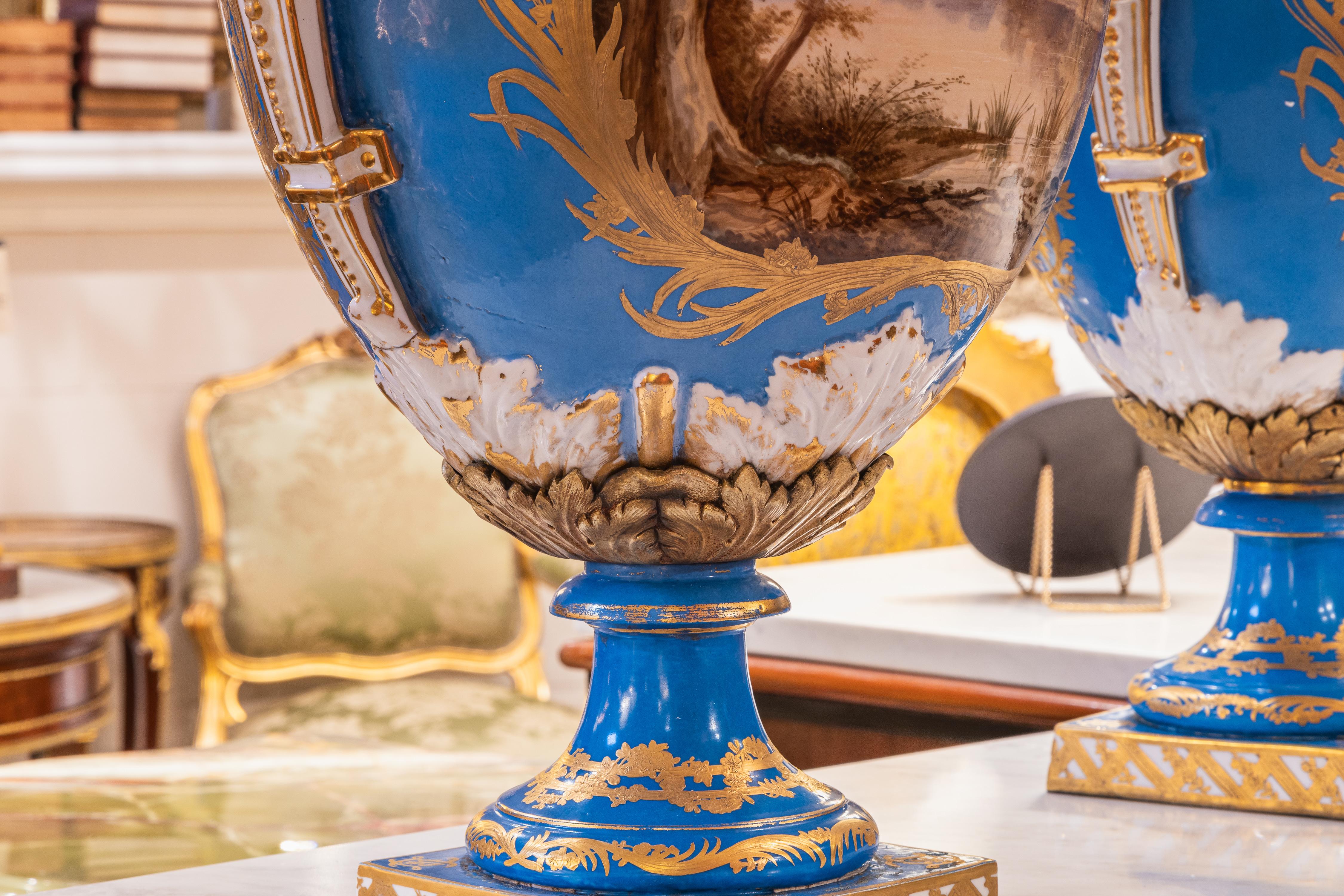 A fine pair of early 20th c  Sevre's style celeste blue palatial porcelain vases 1