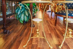 A fine pair of early 20th century gilt bronze and Carrera marble gueridons