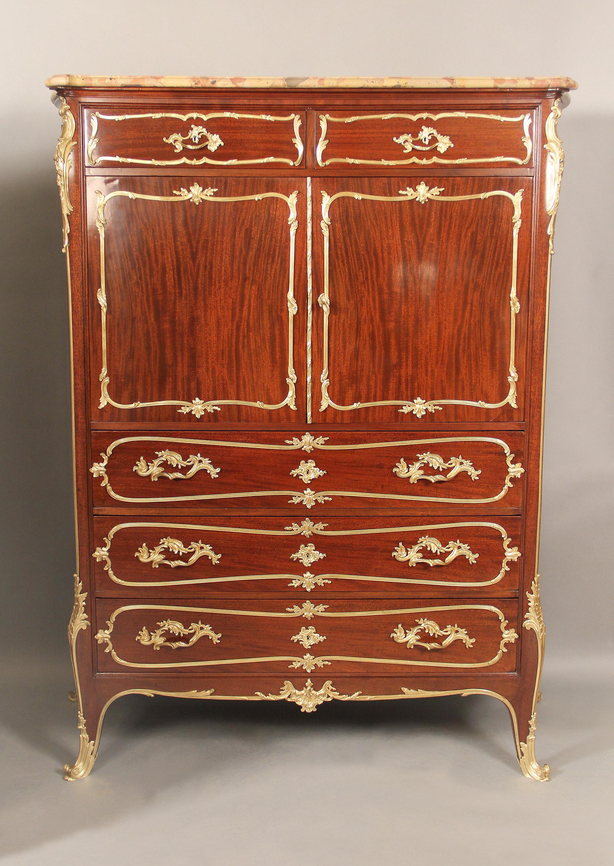 A fine companion pair of early 20th century gilt bronze mounted Louis XV style chest of drawers by François Linke

Surmounted by a Brèche d’Alep marble top above a pair of short drawers, a pair of cupboard doors and three long drawers, each