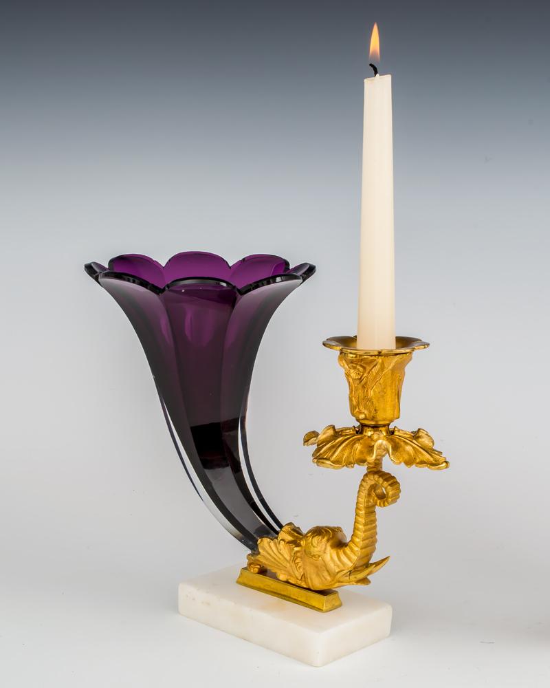 A fine pair of early Victorian cornucopias of exceptional quality on white marble bases mounted with finely chased gilt bronze elephant heads supporting drip pan and candle nozzle, surmounted with rare cut glass amethyst colored cornucopia.