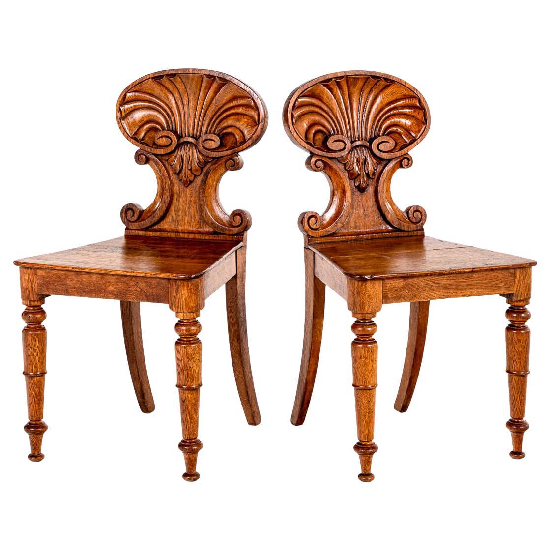 A Fine Pair of English Antique Shell Back Hall Chairs