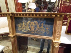 Fine Pair of English Regency Gilt Carved and Eglomise Pier Mirrors