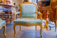 A fine pair of French 19th century Louis XV gilt armchairs.