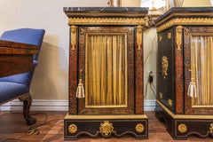 A fine pair of French Boulle and gilt bronze mounted cabinets. Black marble tops