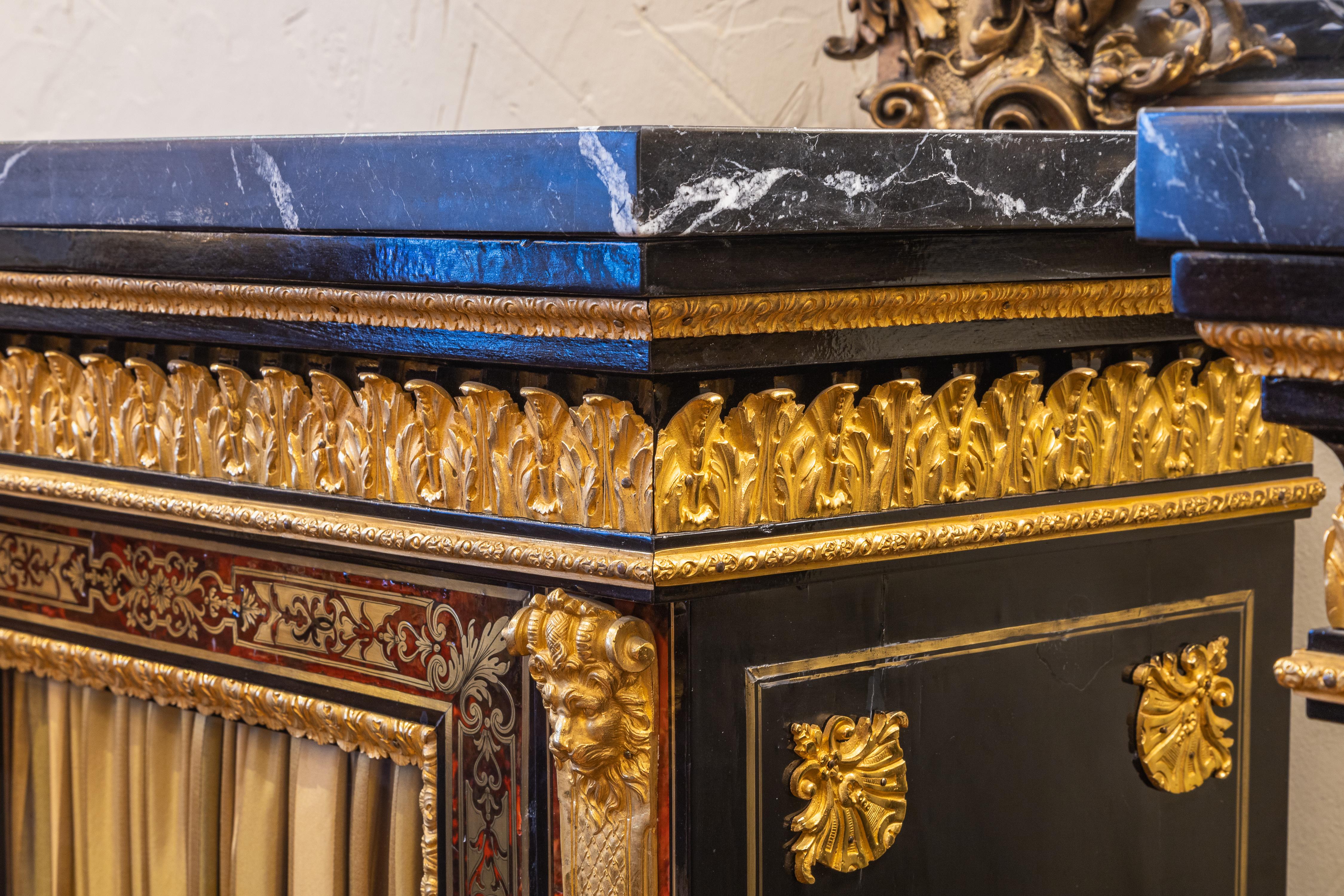 Bronze A fine pair of French Boulle and gilt bronze mounted cabinets. Black marble tops For Sale