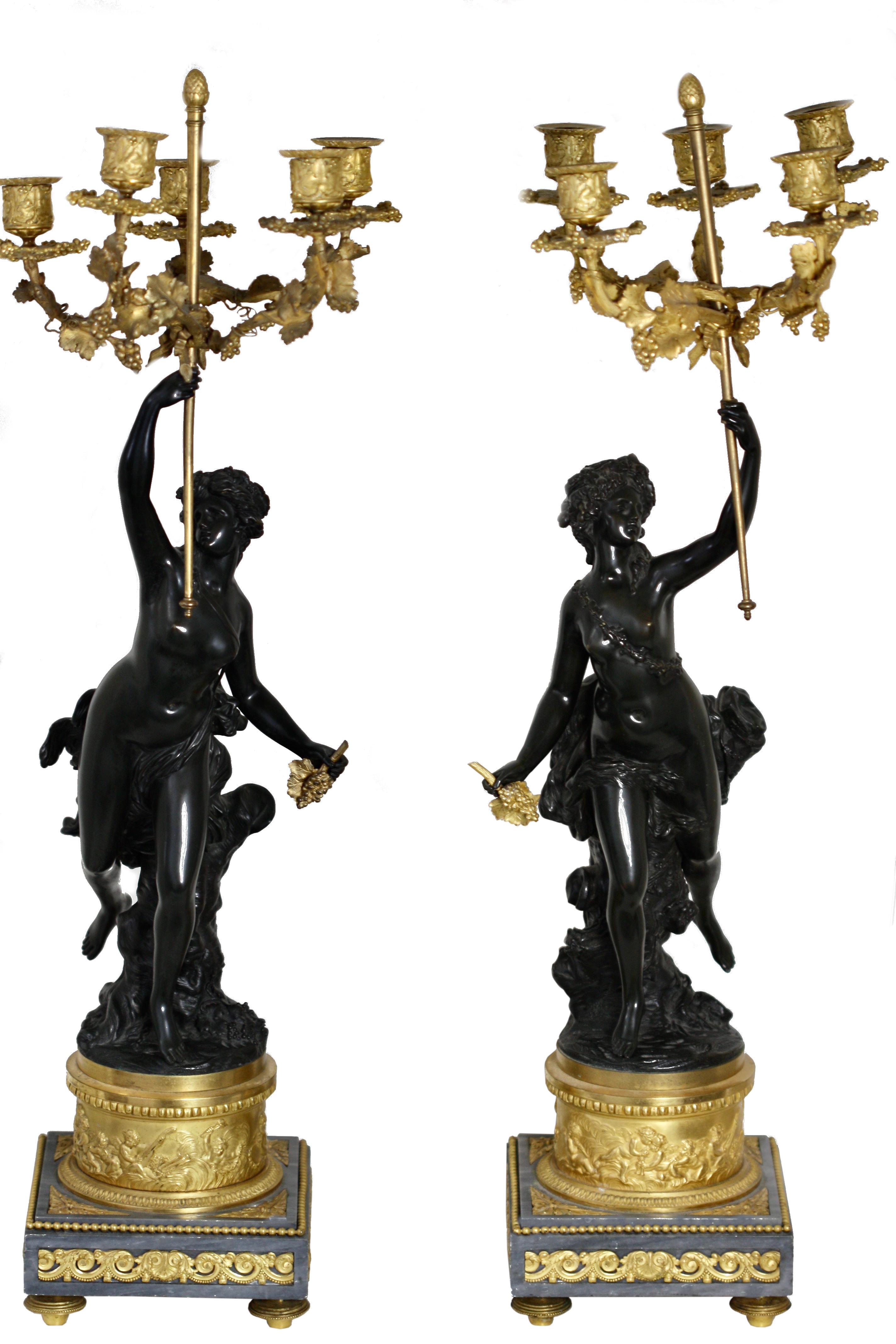 A fine pair of French gilt-and patinated-bronze and marble candelabra
late 19th century, after a model by Clodion, each standing female figure supporting five curved fluted candle branches
raised on turquin bleu marble surrounded by ormolu