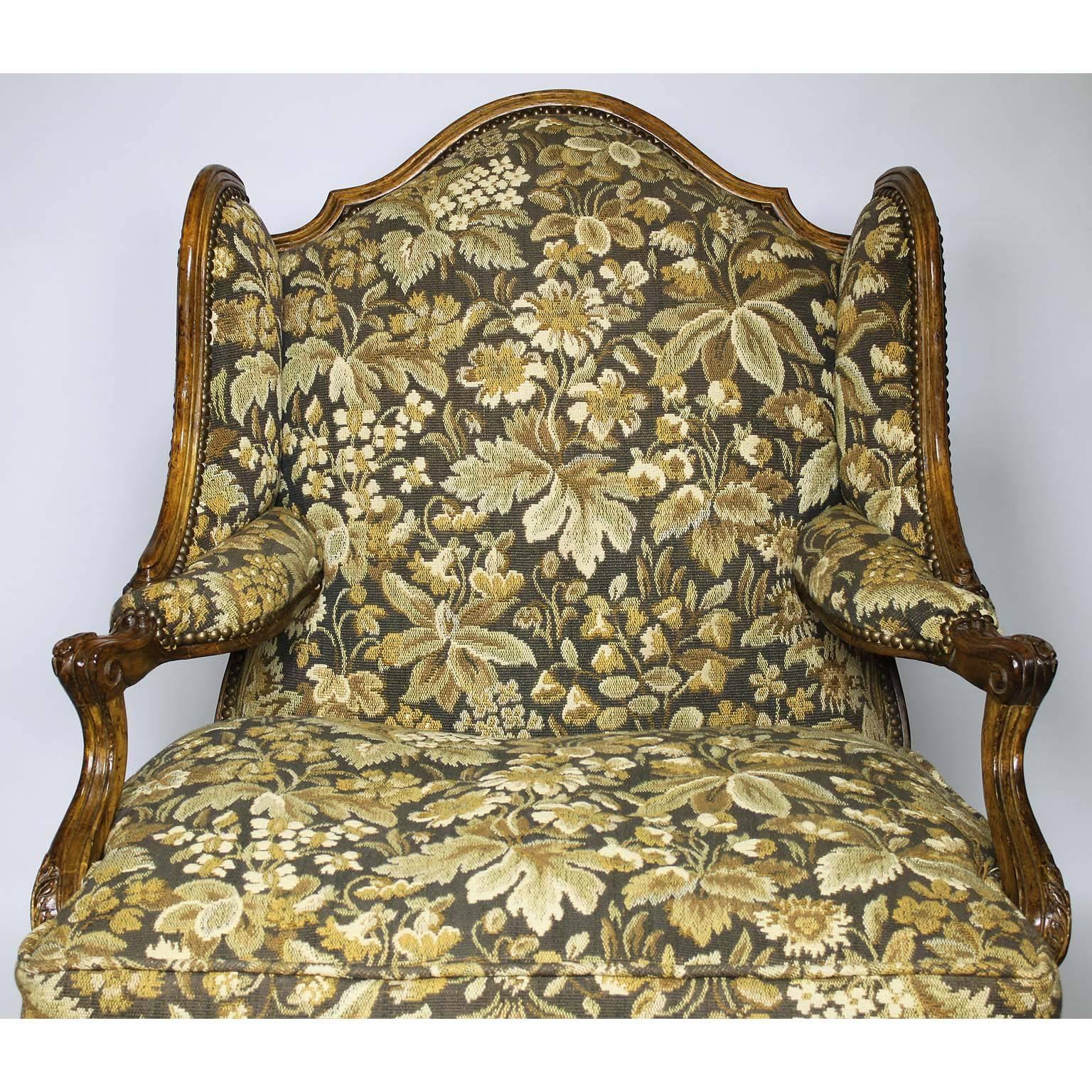 20th Century Fine Pair of French Louis XV Style Carved Walnut Wingback Fauteuil Armchairs