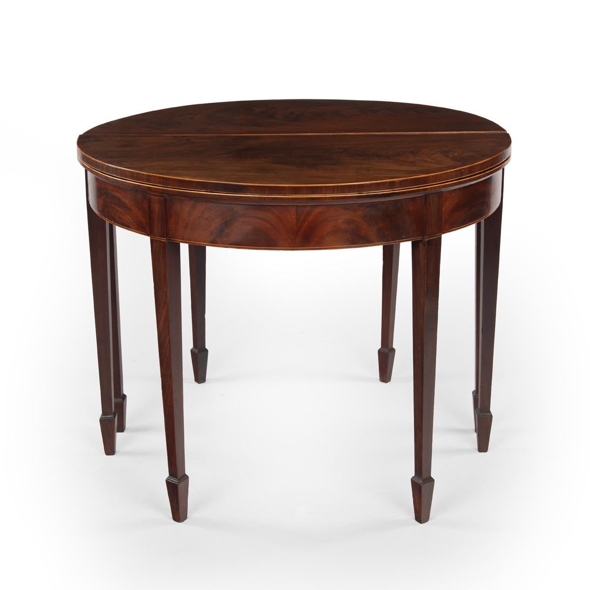 A fine pair of George III period mahogany demilune card tables with provenance 4