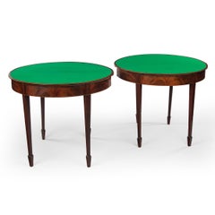 A fine pair of George III period mahogany demilune card tables with provenance