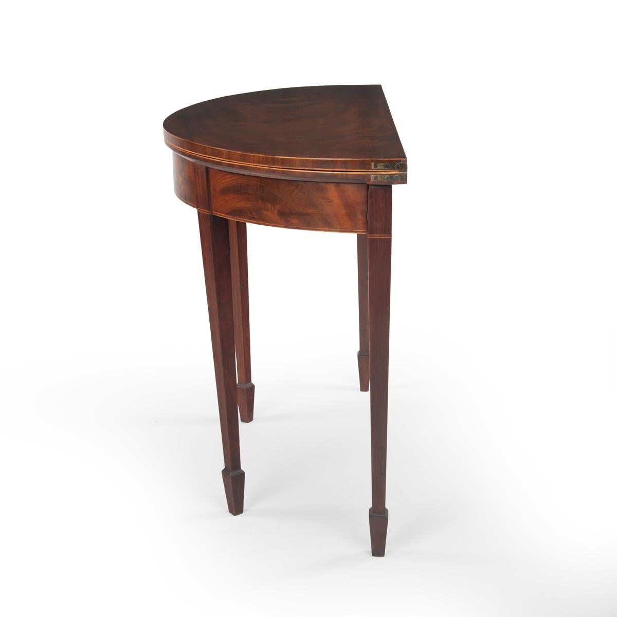Anglais A fine pair of George III period mahogany demilune card tables with provenance