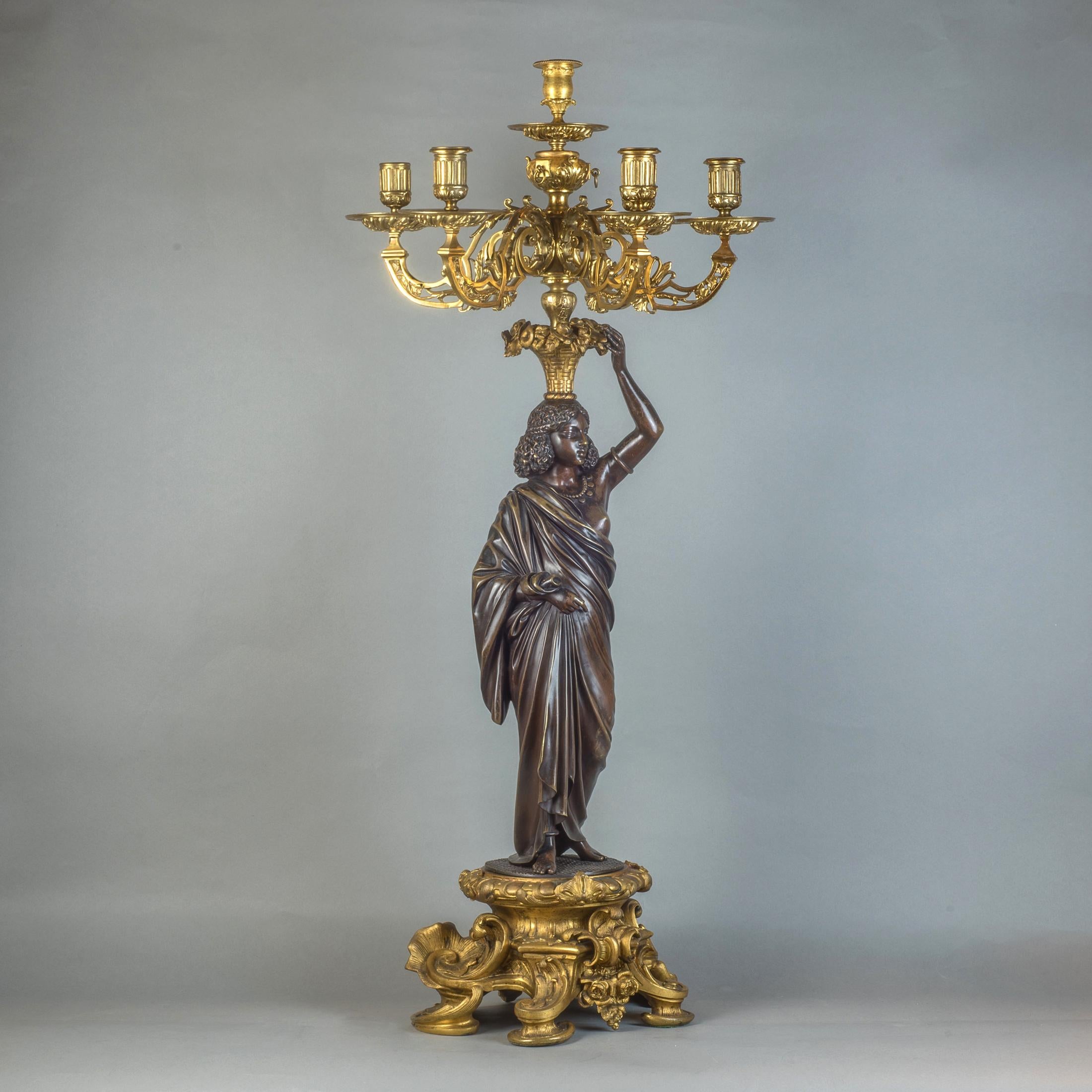 French  Pair of Gilt and Patinated Bronze Nubian Figural Six-Light Candelabras For Sale
