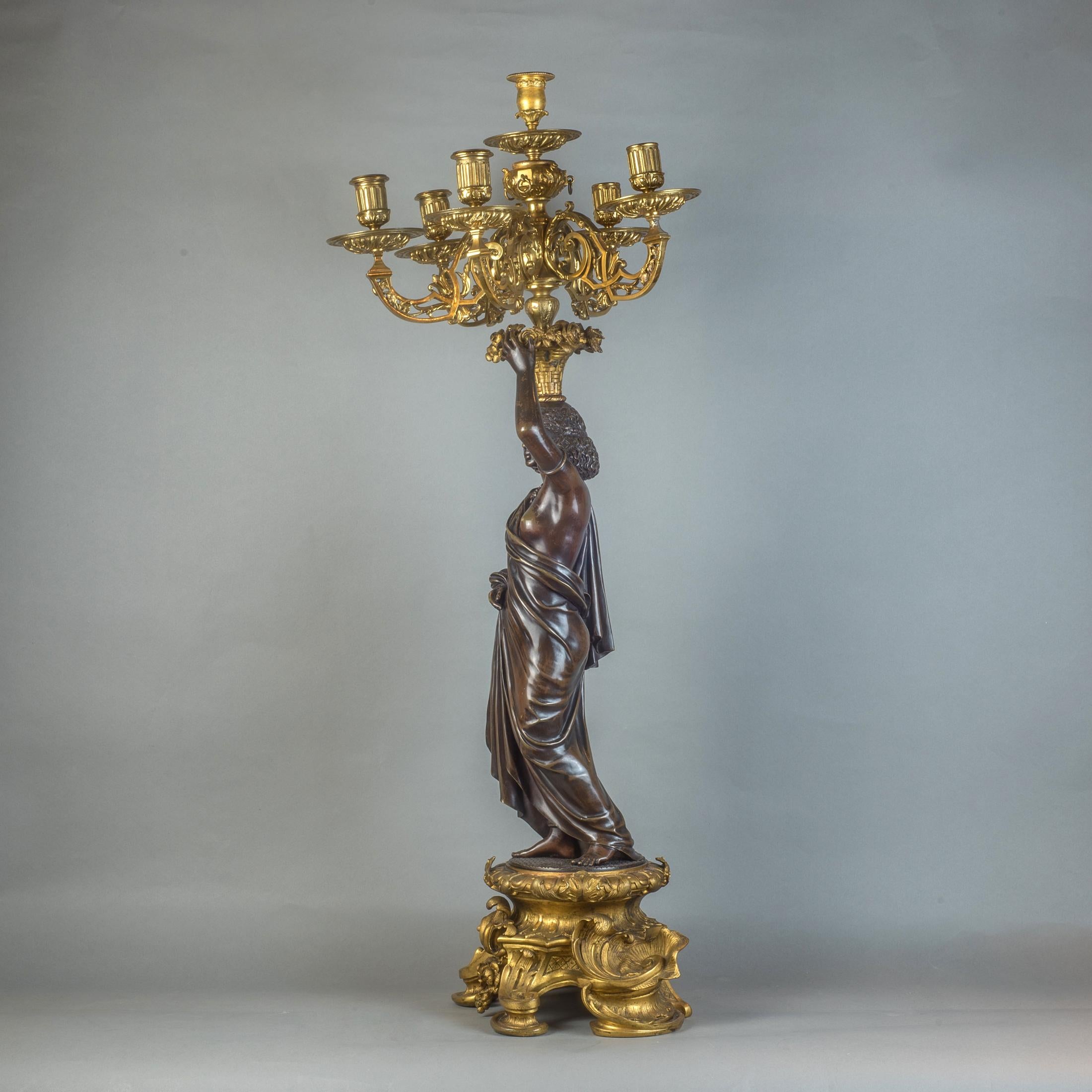  Pair of Gilt and Patinated Bronze Nubian Figural Six-Light Candelabras In Good Condition For Sale In New York, NY