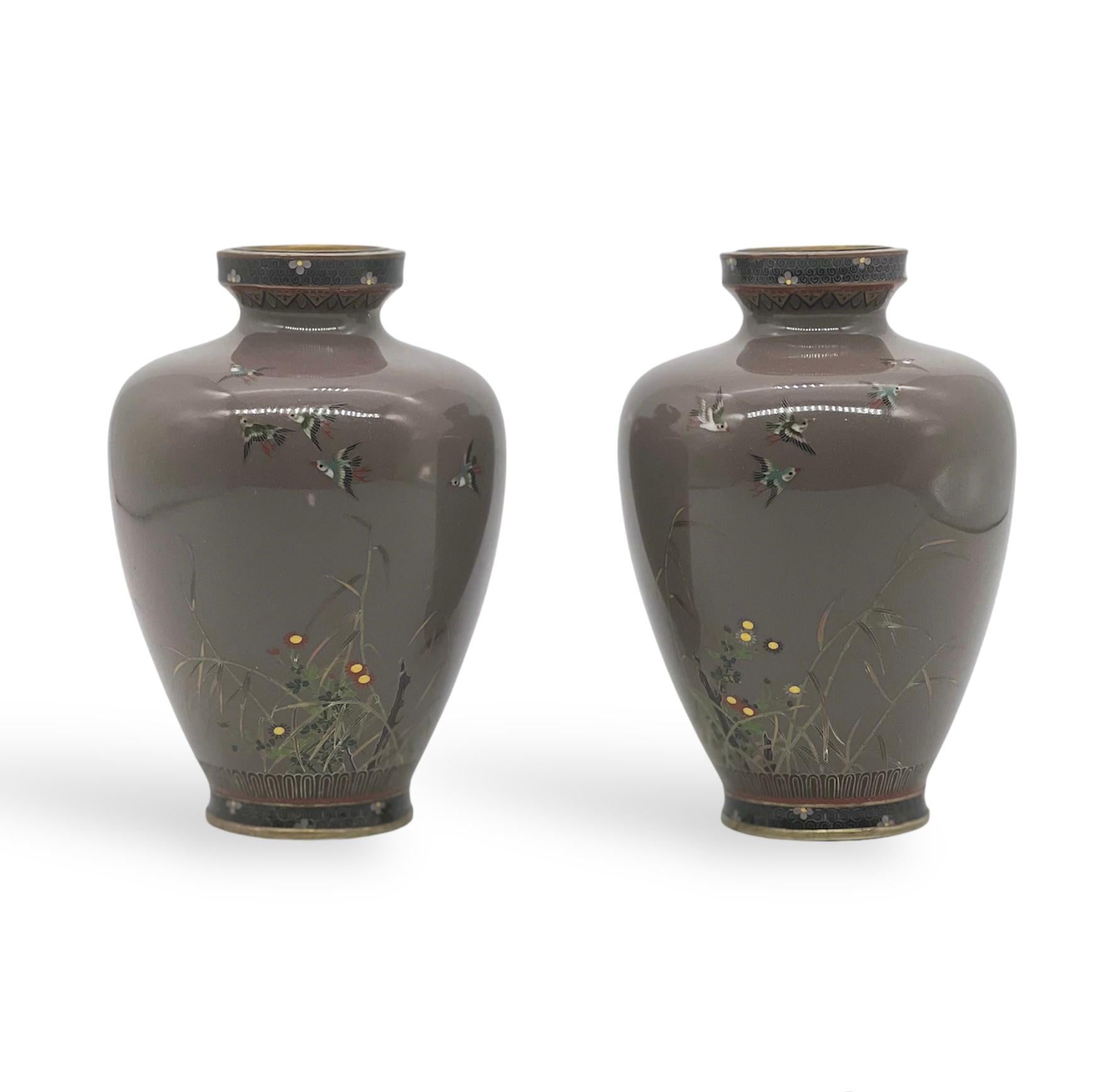 A Exquisite Pair of Japanese Cloisonne Enamel Vases Attributed to Hayashi Kodenji.
Meiji period 19th Century 


A Fine Pair of Japanese cloisonné enamel vases of shouldered tapering form, worked with silver wire and finely decorated with sparrows