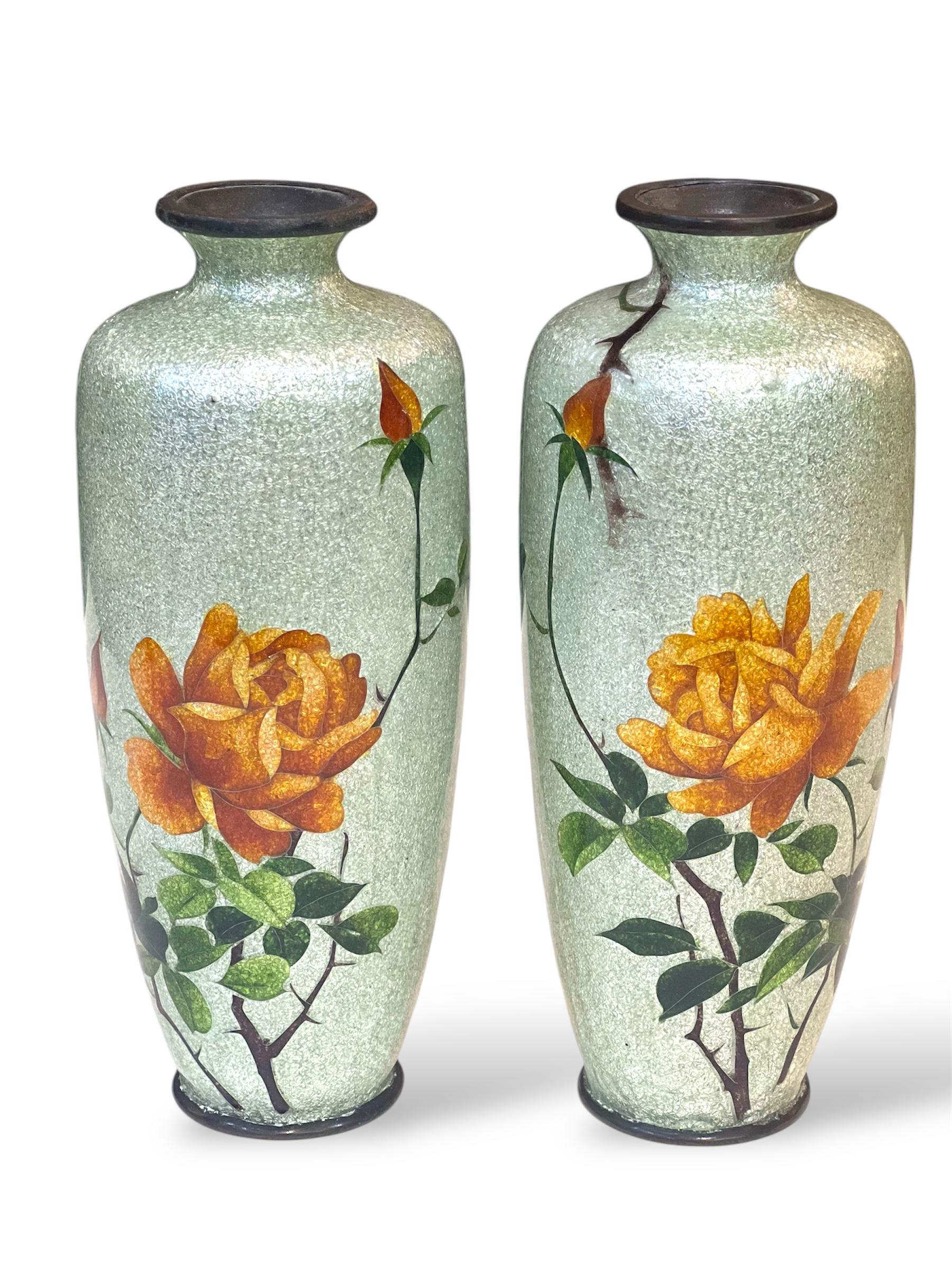 A Fine Pair of Japanese Cloisonné Vases with Ginbari Floral Decoration, Meiji Period (late 19th – early 20th century)

Of elegant baluster form with gently flared necks, this refined pair of Japanese cloisonné vases is decorated with vivid