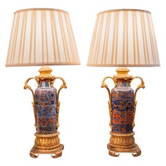 A fine pair of Japanese water bottles with gilt bronze mounts made into lamps