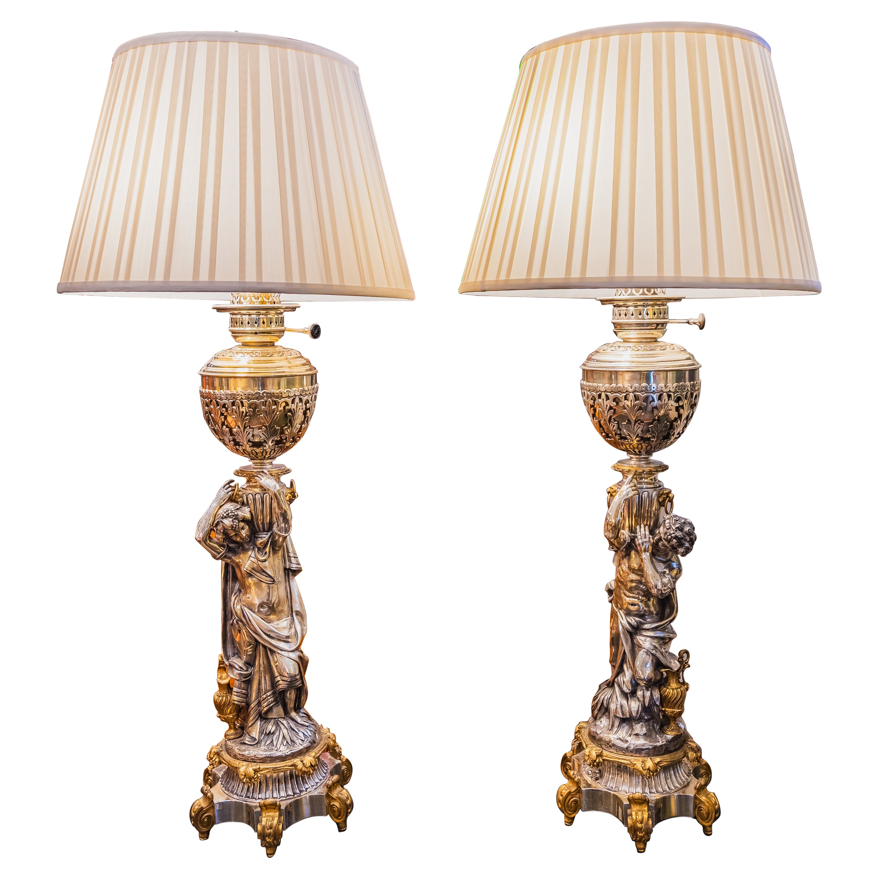 A fine pair of large 19th c Classical figural silver dore and gilt bronze lamps