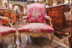 A fine pair of large 19th century French Louis XV gilt carved armchairs