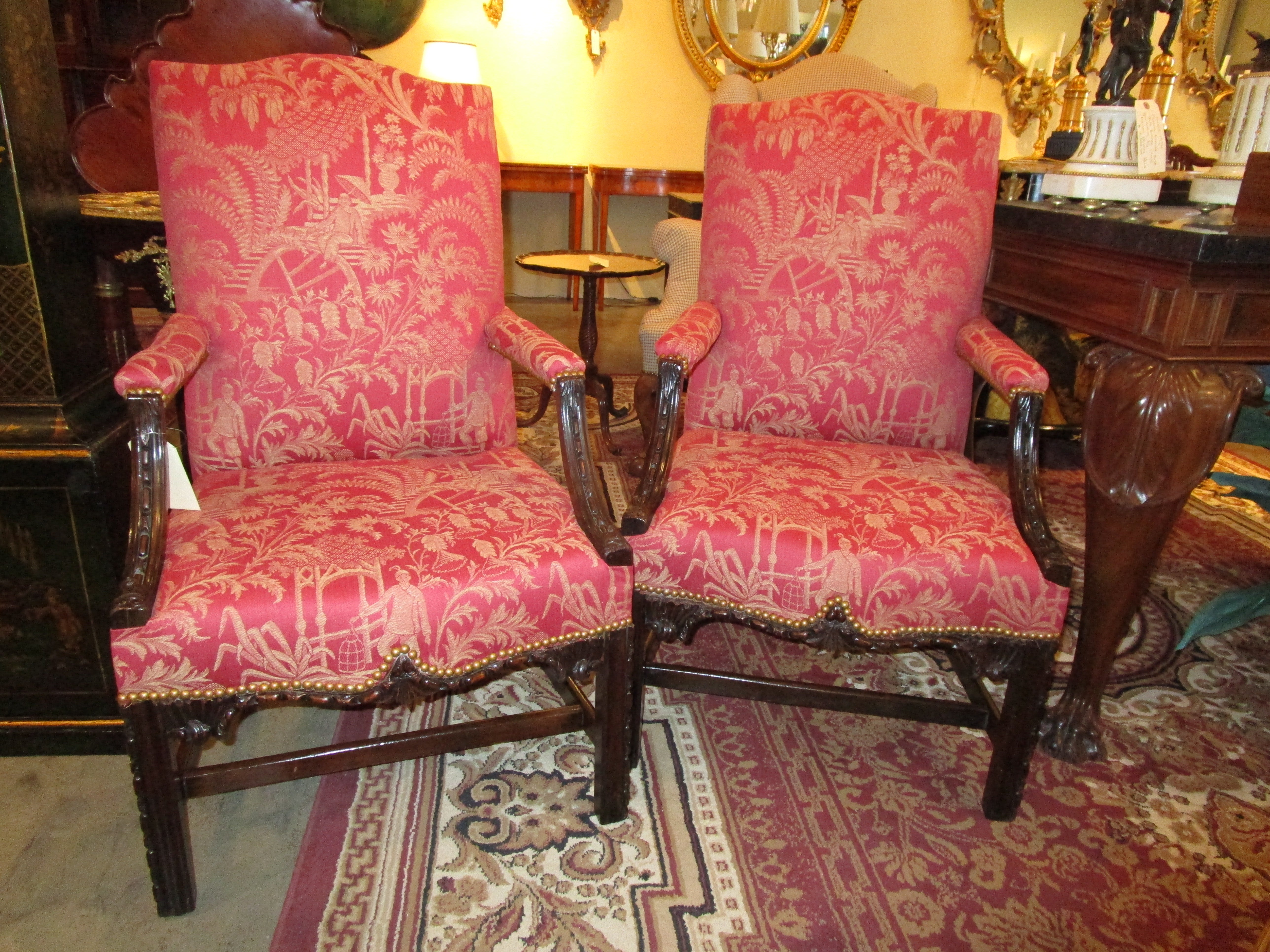A fine and rare pair of late 18th century Chinese Chippendale mahogany carved armchairs. Beautiful detail with a Chinese material in excellent condition.