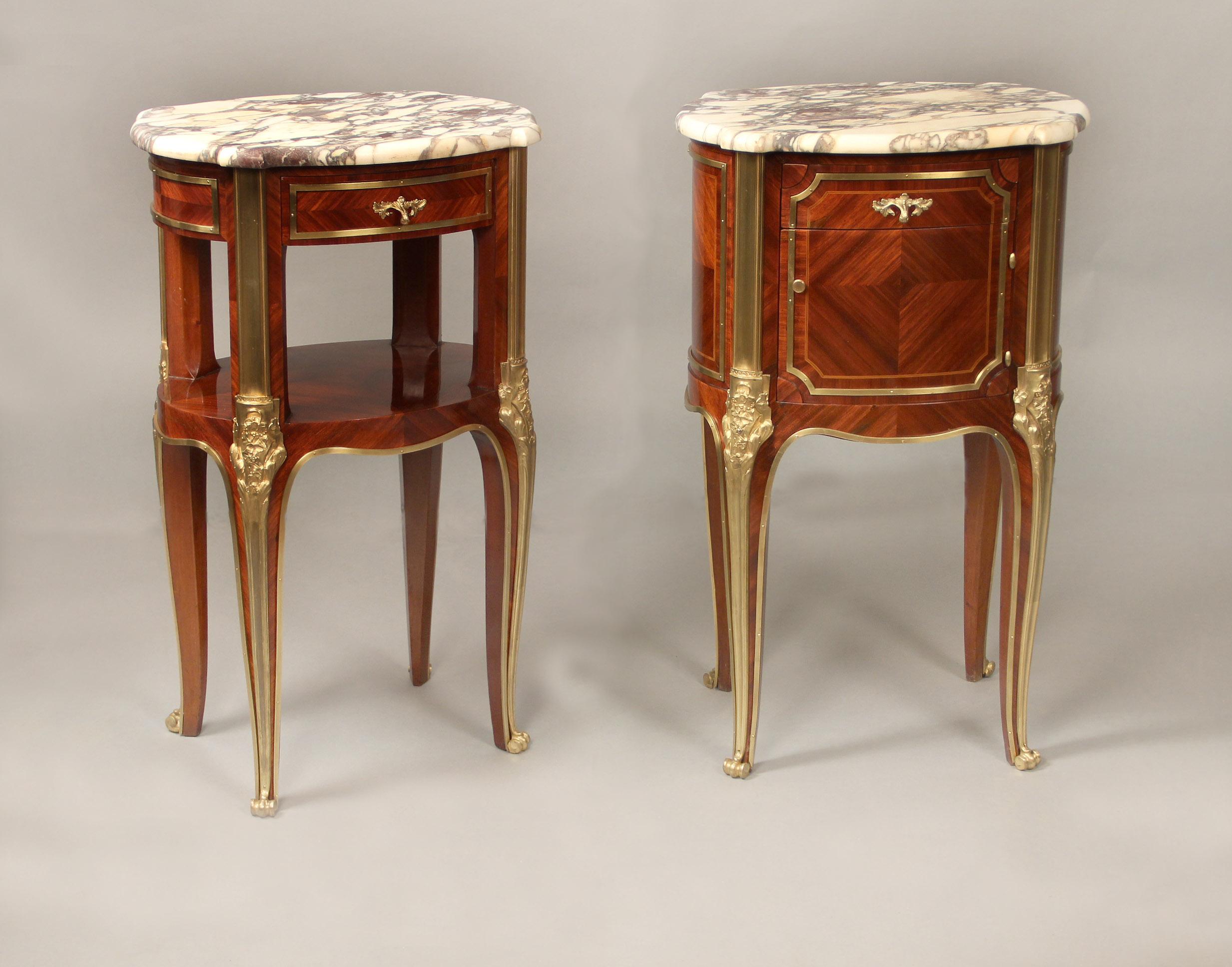 A fine pair of late 19th century gilt bronze mounted Louis XV style night tables

Both with marble tops, one with a single drawer above an opening, the other with a drawer above a single door opening to a marble interior, the back and sides