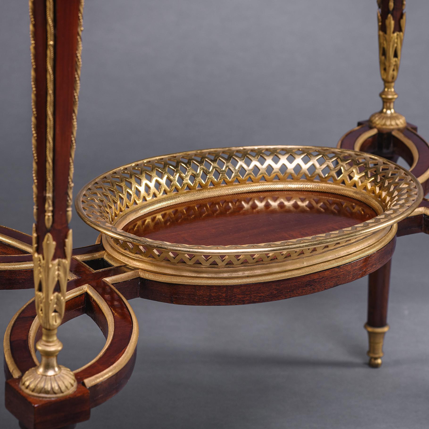 19th Century A Fine Pair of Louis XVI Style Gilt-Bronze Mounted Mahogany Occasional Tables For Sale