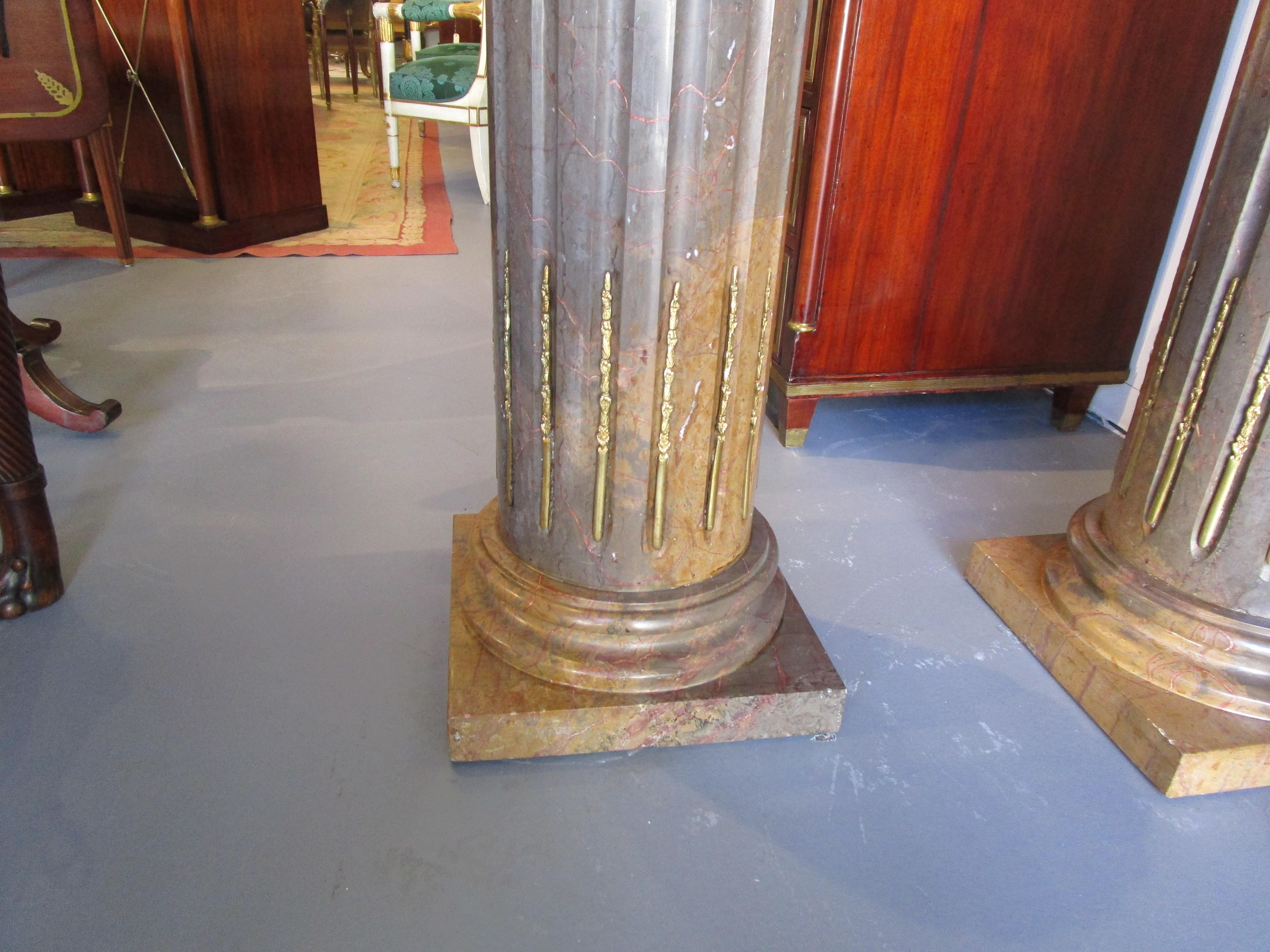 A Fine pair of Classical marble and gilt bronze mounted column designed pedestals.