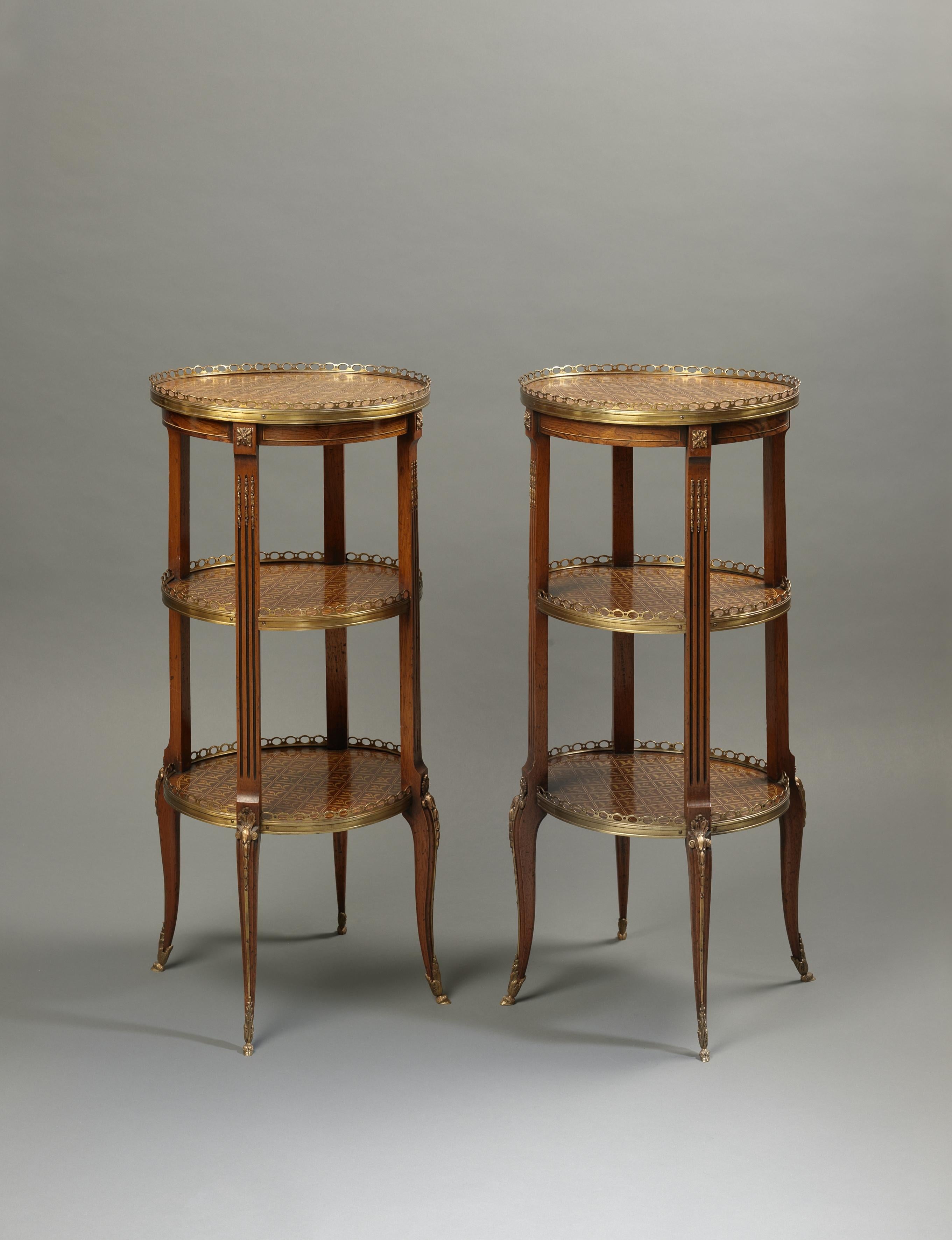 A fine pair of Marquetry inlaid three tier ètagère tables.

French, circa 1890. 

The galleried tiers inlaid with floral lattice marquetry inlay.