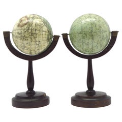 Antique A fine pair of miniature globes on stands