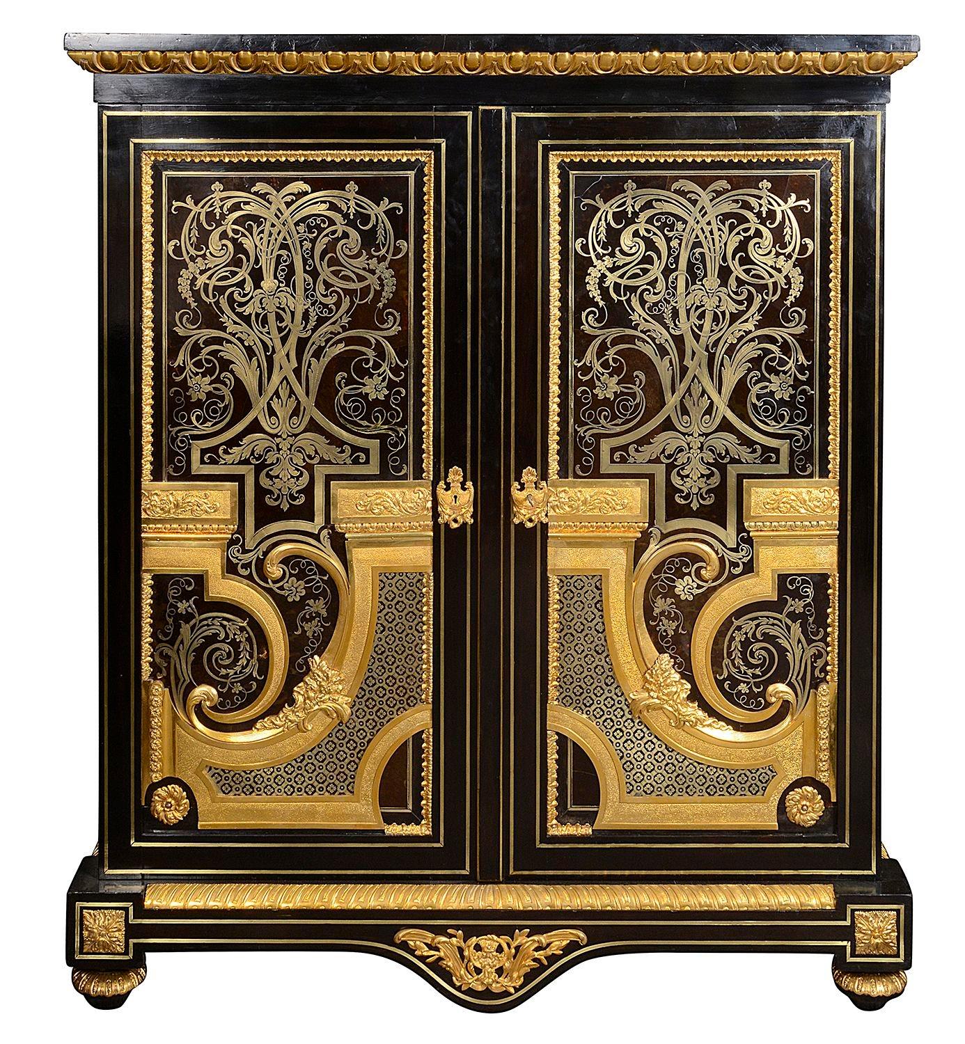 A fine quality pair of Napoleon III boulle ebonised, cut-brass inlaid and gilded ormolu-mounted two door side cabinets. 
In the manner of; Andre-Charles Boulle
Batch 71 SUZZZN 54522.
 