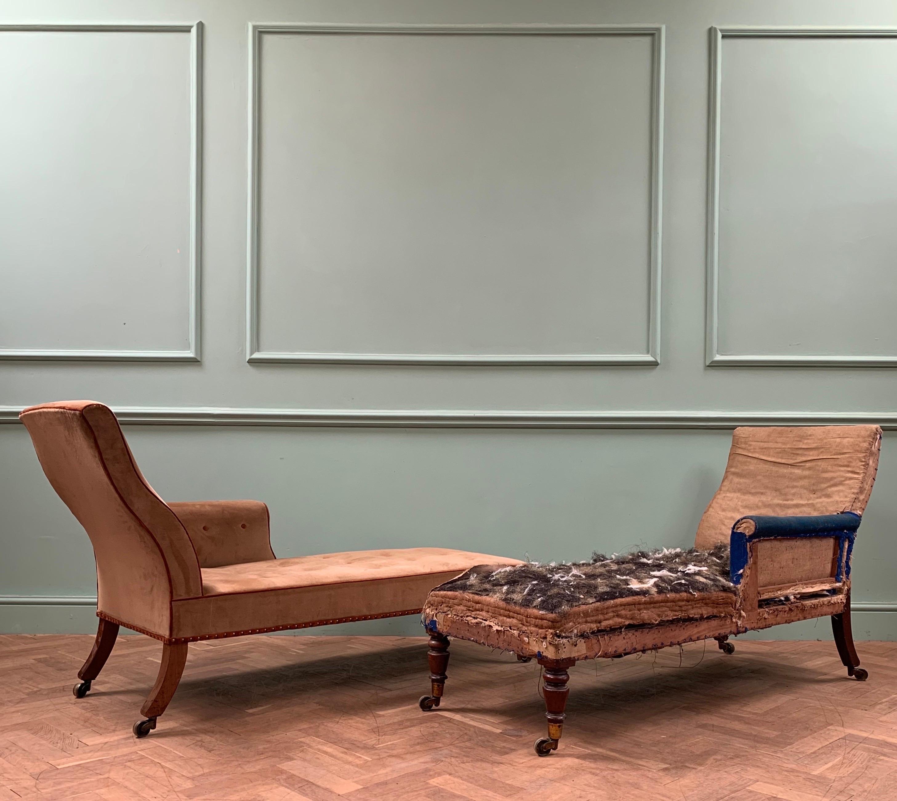 A pair of highly elegant English regency daybeds, with an S shaped backrest, terminating in mahogany sabre legs and brass castors made by Cope and Collinson, each with a single arm rest and the highest quality mahogany to turned front legs. 

For