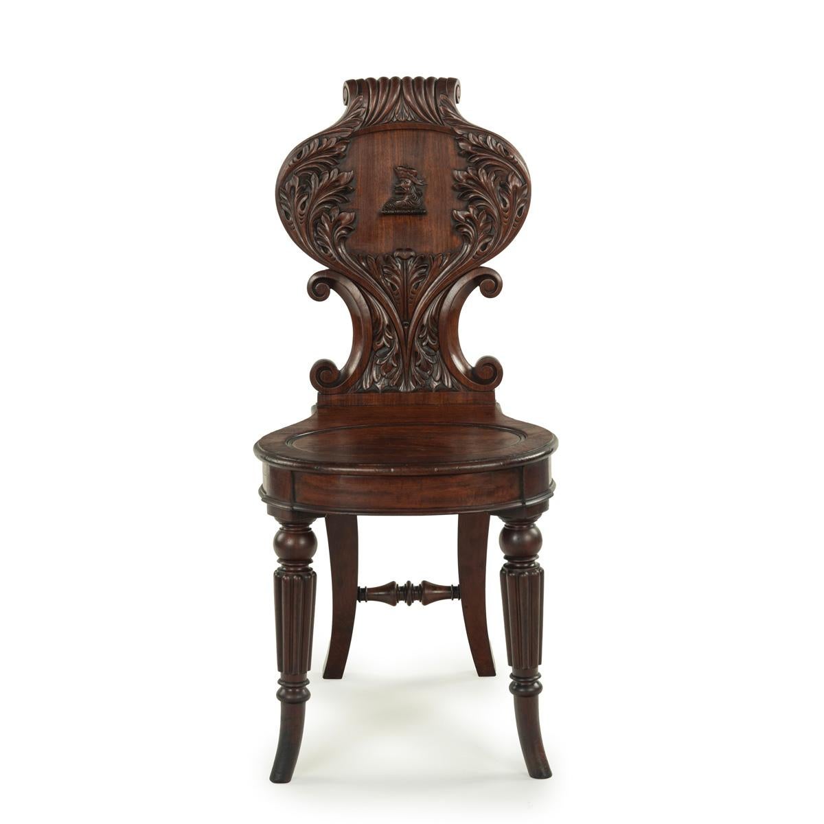 English A fine pair of Regency mahogany armorial hall chairs attributed Gillows For Sale