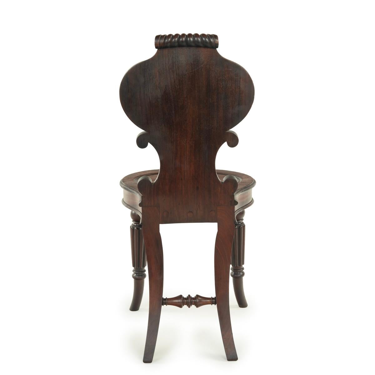 A fine pair of Regency mahogany armorial hall chairs attributed Gillows For Sale 1