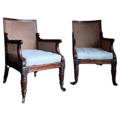 Antique A fine pair of regency mahogany bergere library armchairs, c.1815