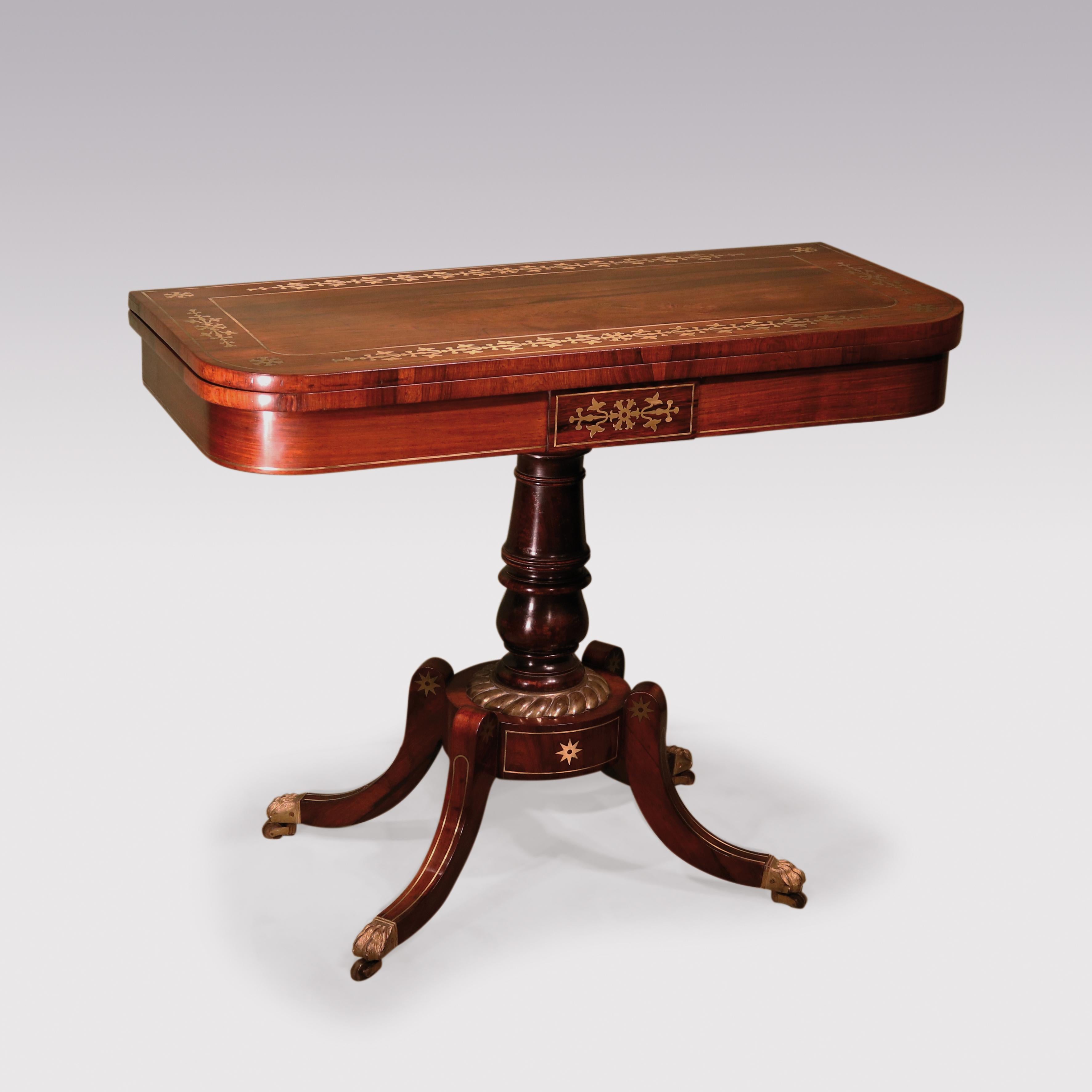 A fine pair of 19th century Regency period figured rosewood card tables. The rounded rectangular tops are cross banded and inlaid with decorative brass motifs. Raised above a panelled frieze and simulated baluster turned stem and ending in four