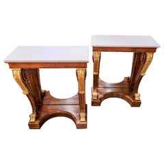 A fine pair of Regency rosewood and parcel gilt console tables