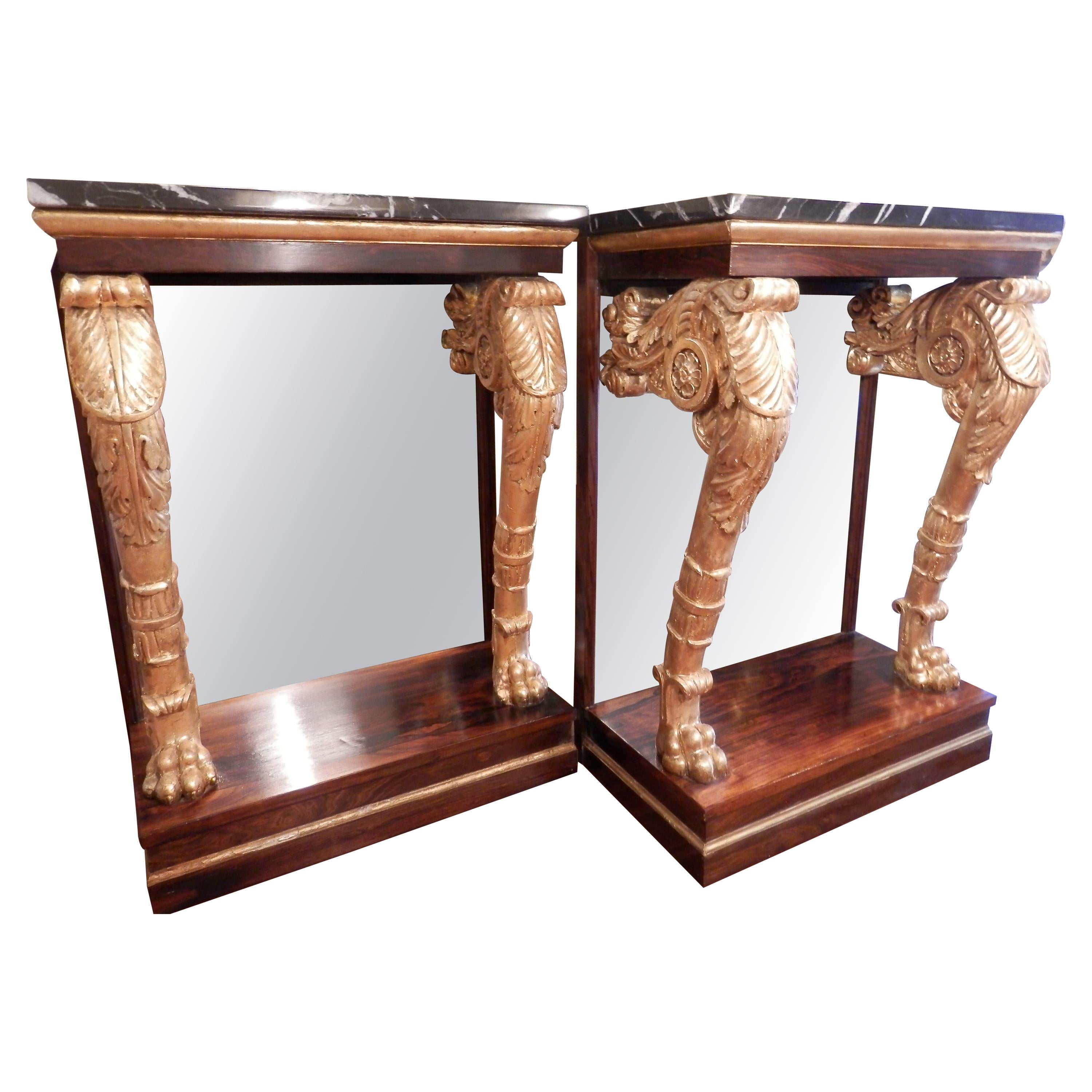 A fine pair of Regency rosewood and parcel gilt marble top consoles 