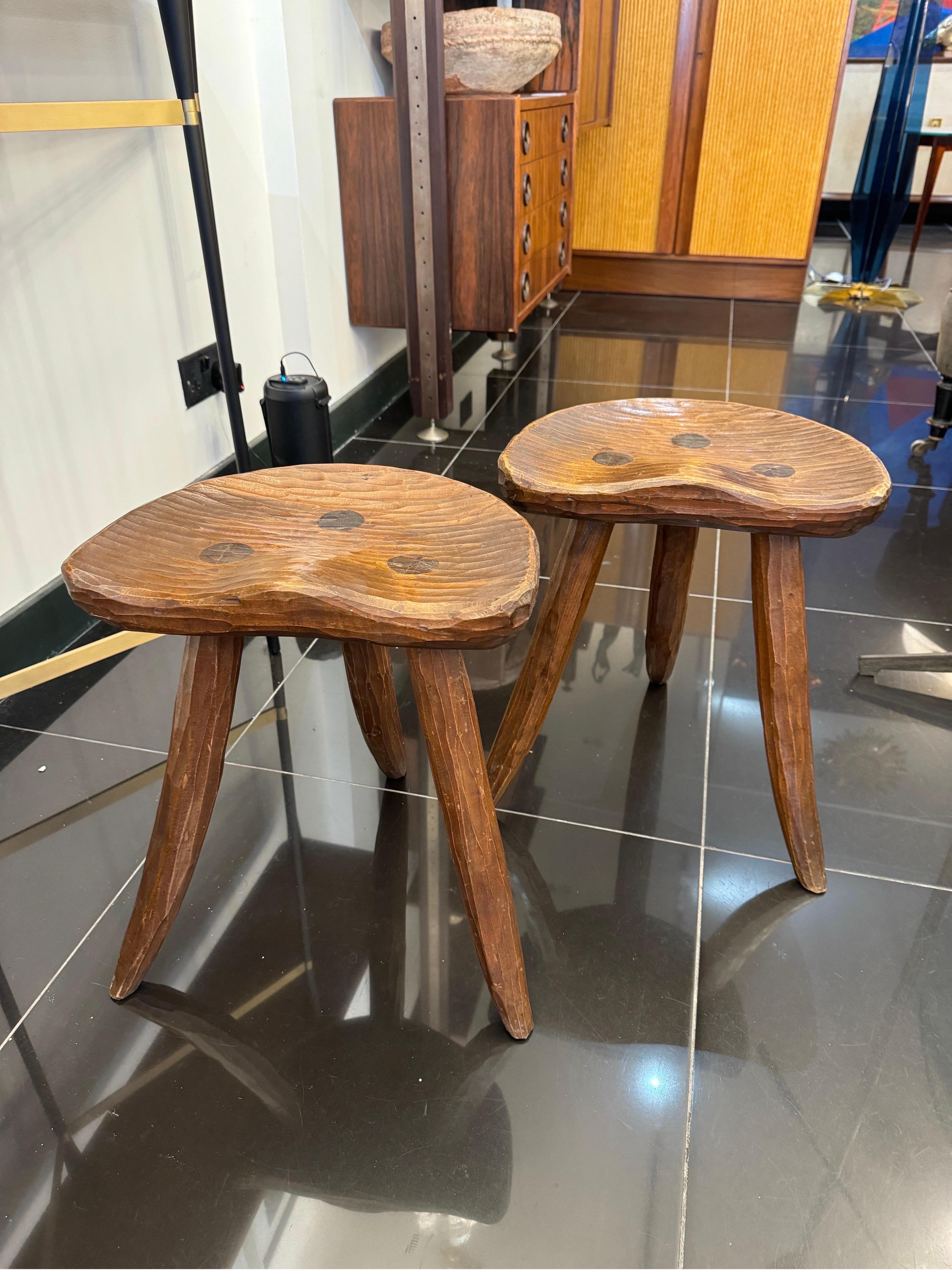 A pair of Italian handmade solid oak saddle seats stools 