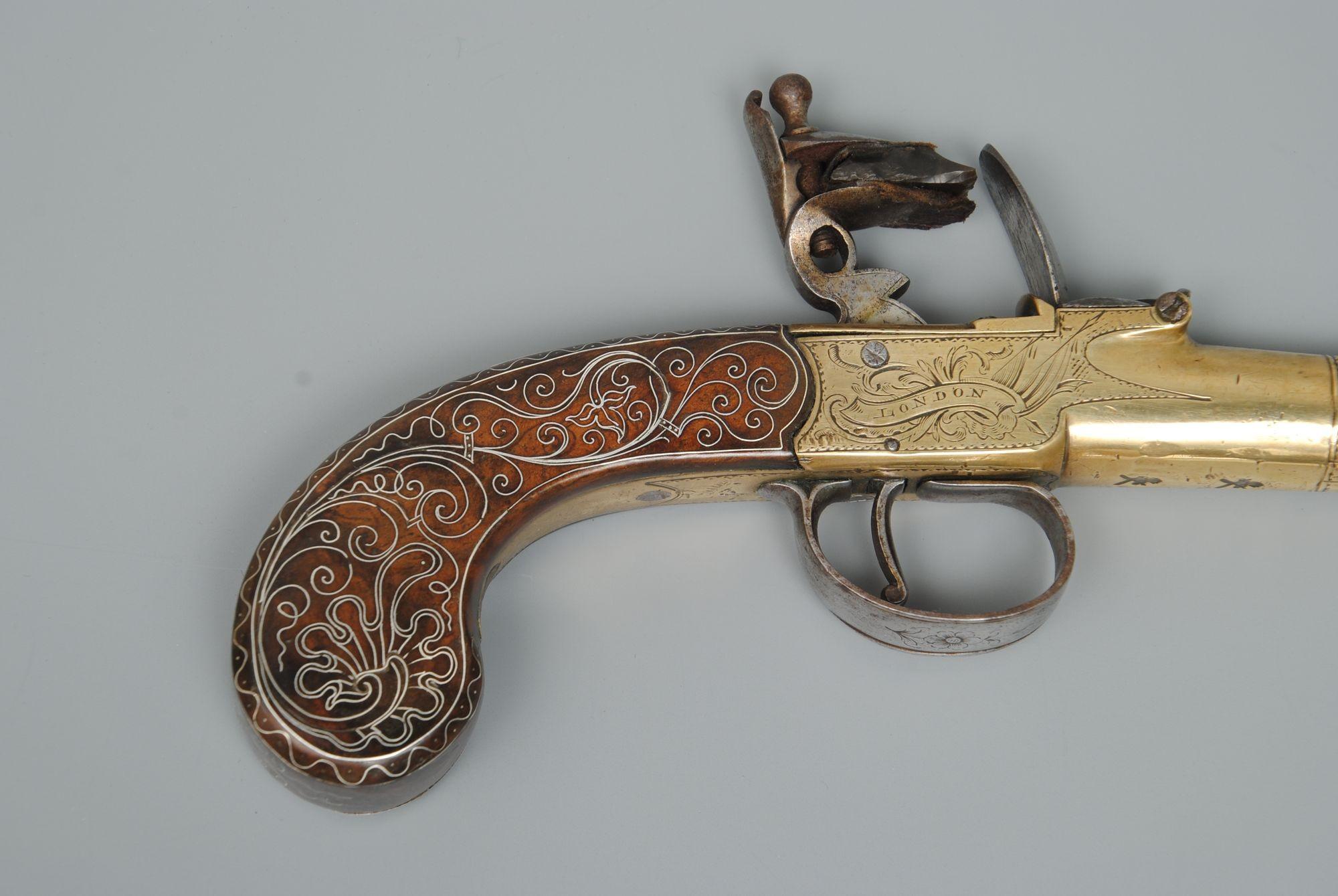 English A Fine Pair Of Silver Inlaid Brass Barrelled Pistols By Bunney London