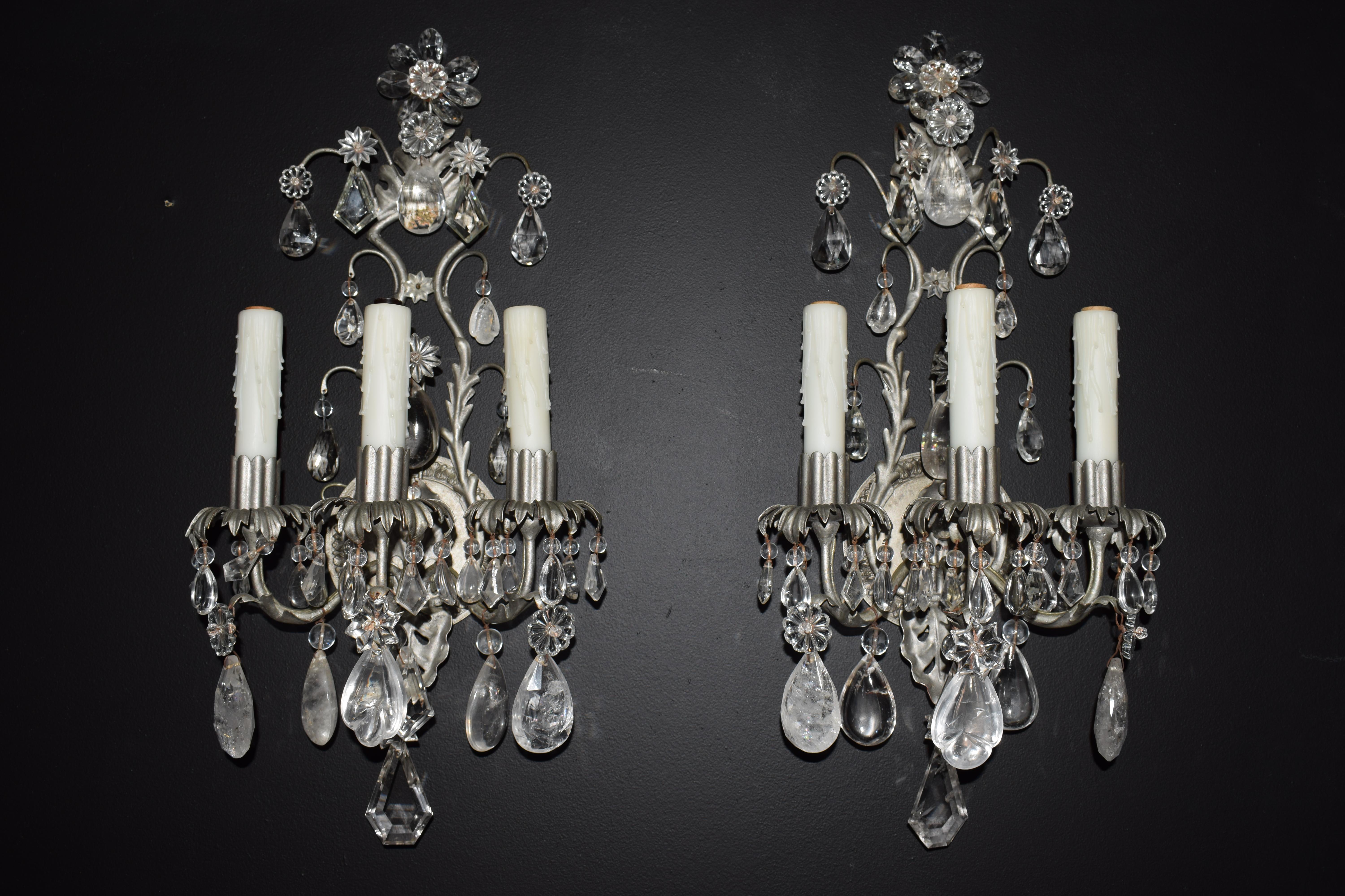 A Fine pair of silvered, crystal and rock crystal wall sconces.
France, circa 1940. 3 lights
Dimensions: Height 23