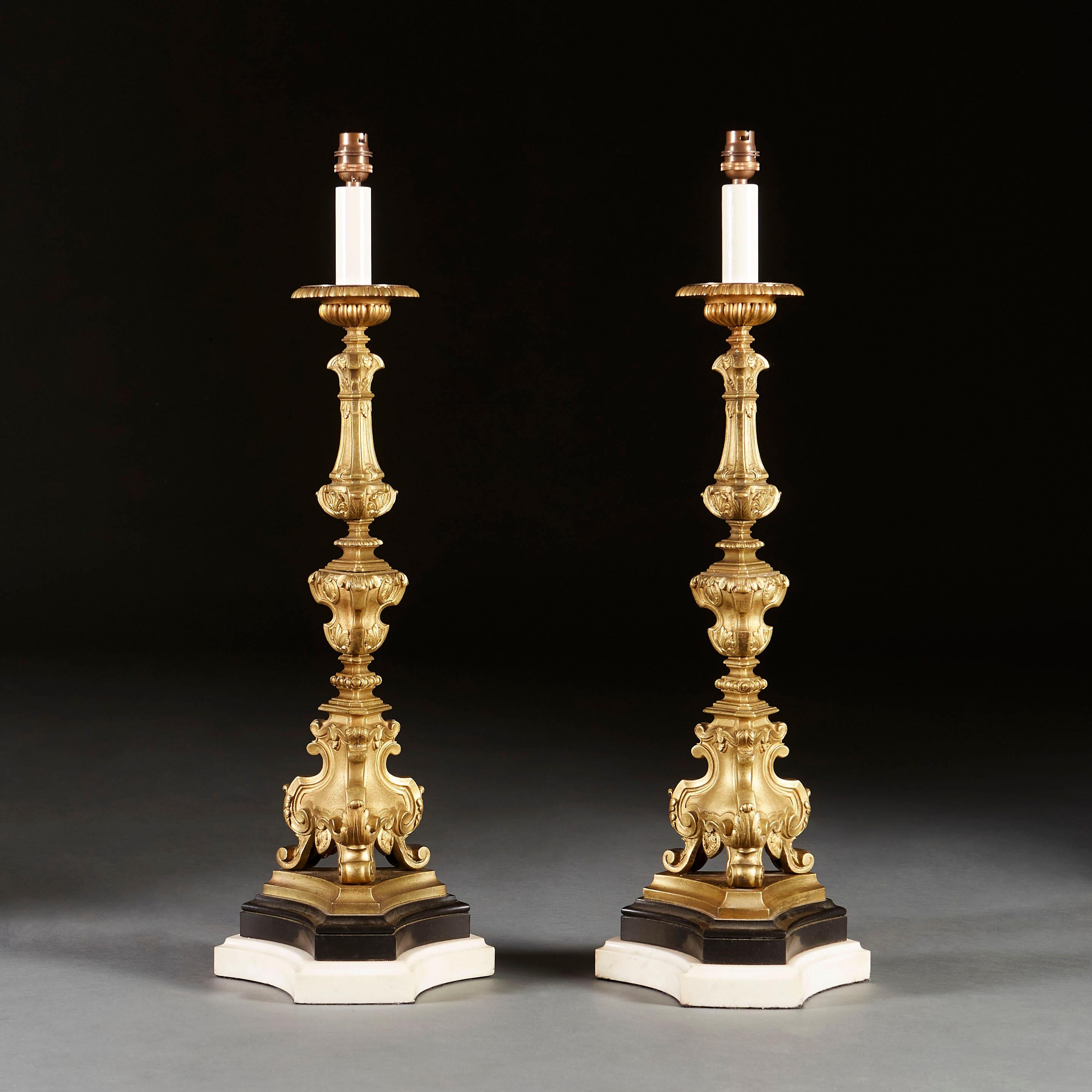 A Fine pair of early 19th century candlestick lamps, supported on marble plinths.