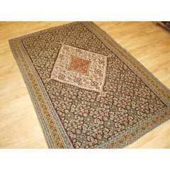 A Fine Persian Senneh Kilim with a Traditional Medallion Design