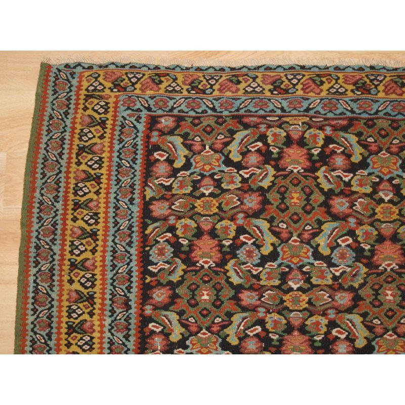 Asian A Fine Persian Senneh Kilim with a Traditional Medallion Design For Sale