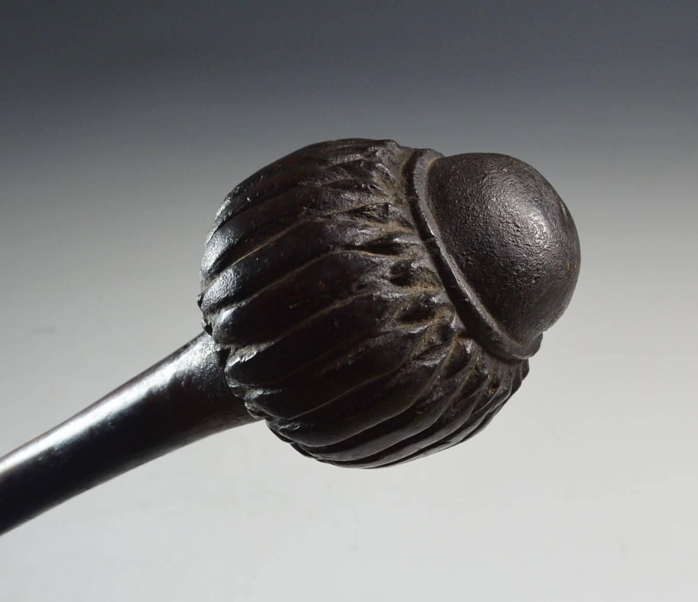 A fine quality 19th century Fiji antique Ula throwing club

Hand iron wood with carved Multi lobed head 

Deep  aged patina.

Excellent condition with no cracks,

Period: early 19th century,

Size: 42 cm comes with custom stand,

Provenance: UK