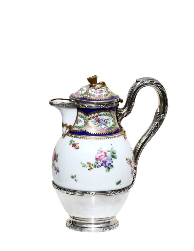 A fine porcelain silver mounted tea pot and cover
19th century
possibly Meissan
with underglaze blue crossed swords mark
Measures: Height 7.62 in. (19.4 cm.)