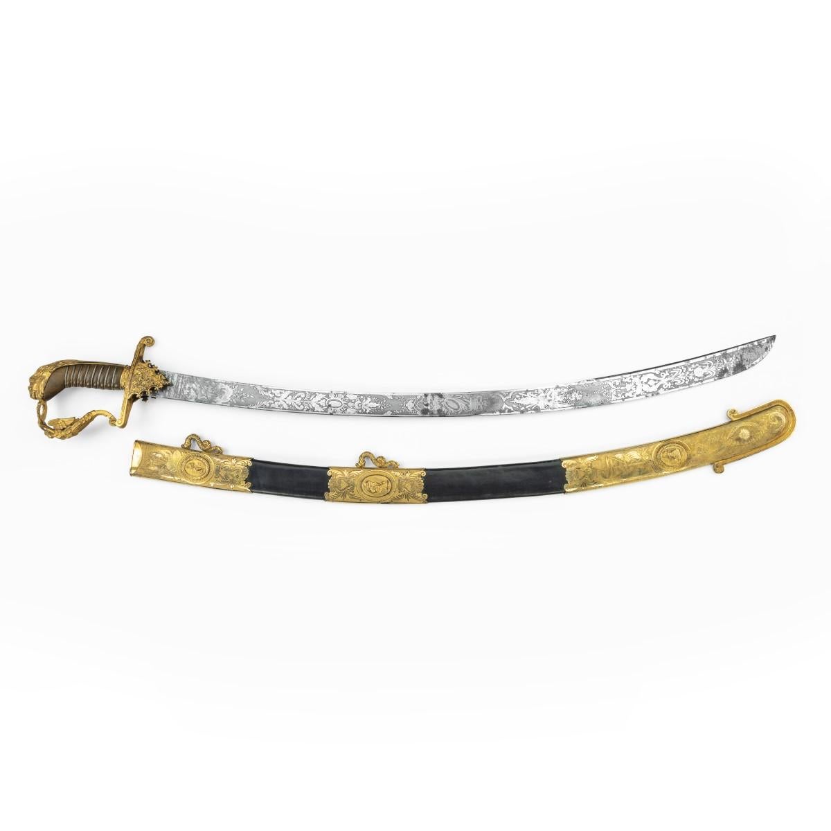 A fine presentation sword given to Lieutenant Charles Peake as a token of gratitude by the Men of His Ship when recommissioned for Foreign Service in 1821, the citation reading, the curved hatchet point blade etched along its entire length with