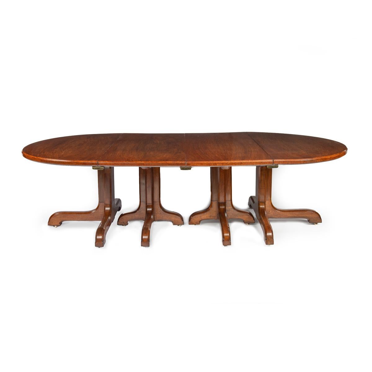 English A Fine Quality and Large Four Pillar Brown Oak Extending Dining Table, c.1900 For Sale