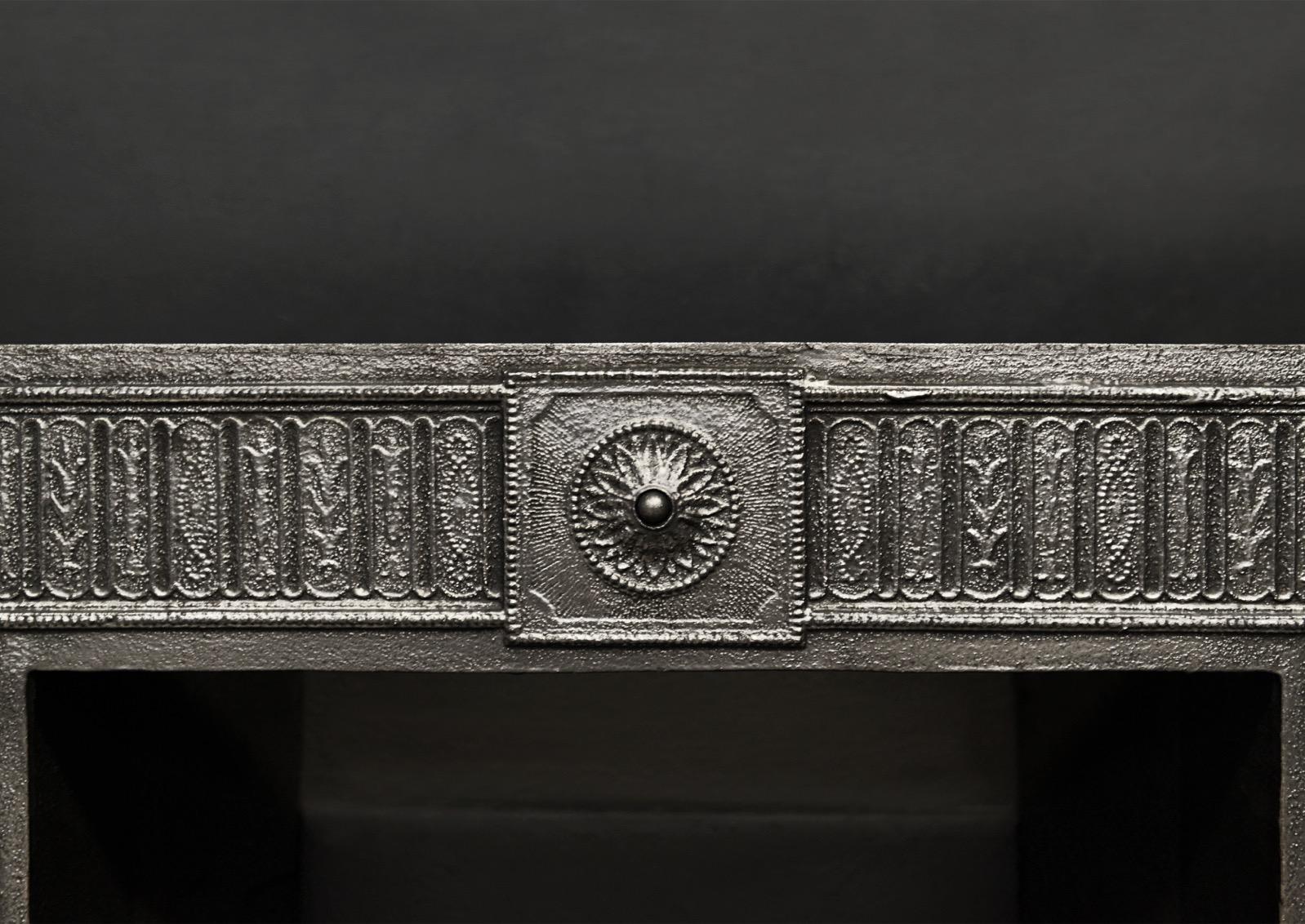 A fine quality decorative cast iron register grate. The outer frame with adorned with paterae, panelling and beading throughout. The burning area with urn finials, shaped front bars and pierced, fluted fret. English, early 19th century, possibly