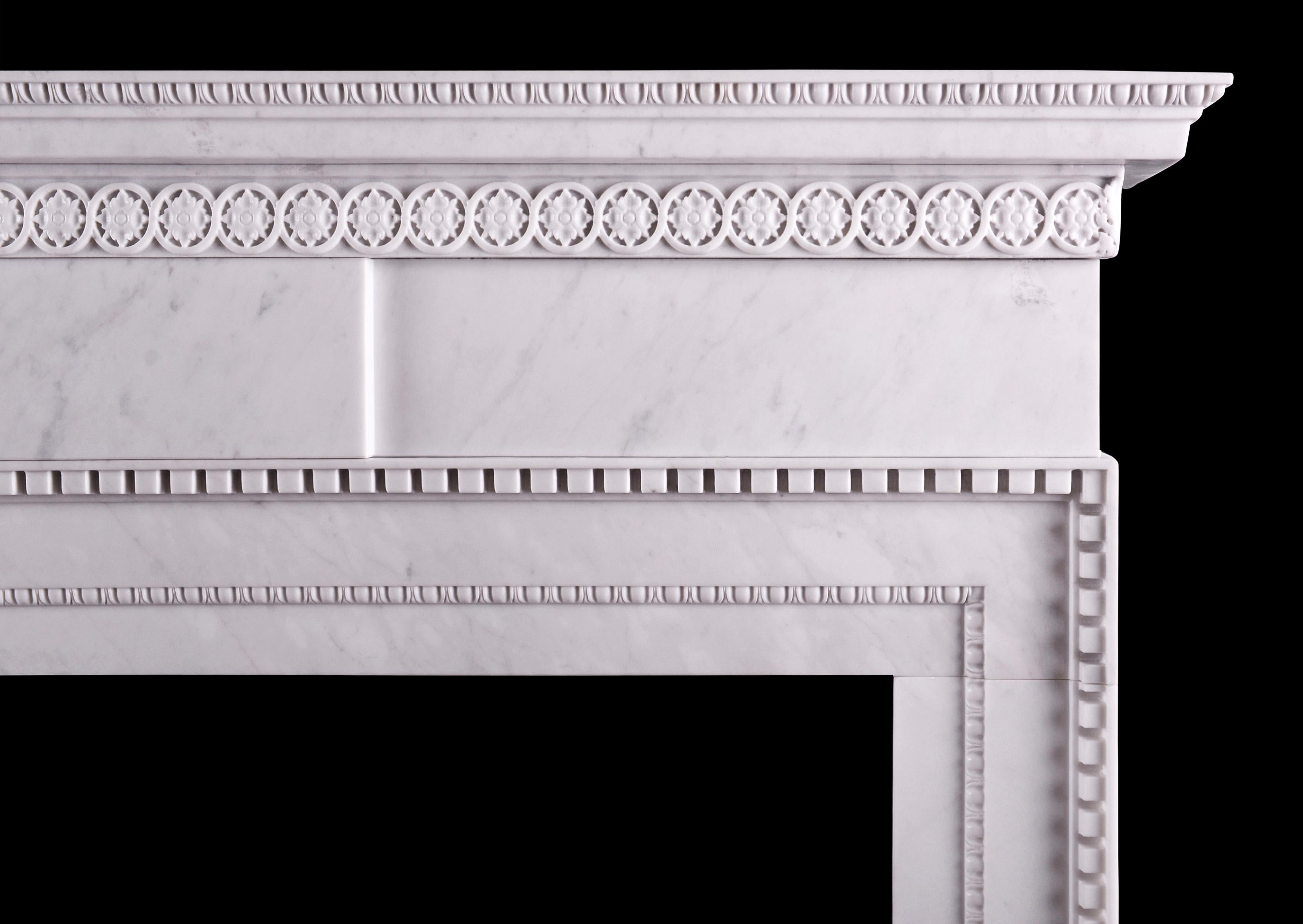 A fine quality English fireplace in the mid Georgian style, in Italian Carrara marble. The frieze with plain centre tablet, the jambs with delicate inner moulding of egg-and-dart and carved acanthus leaves to corners. The shelf with carved rosette