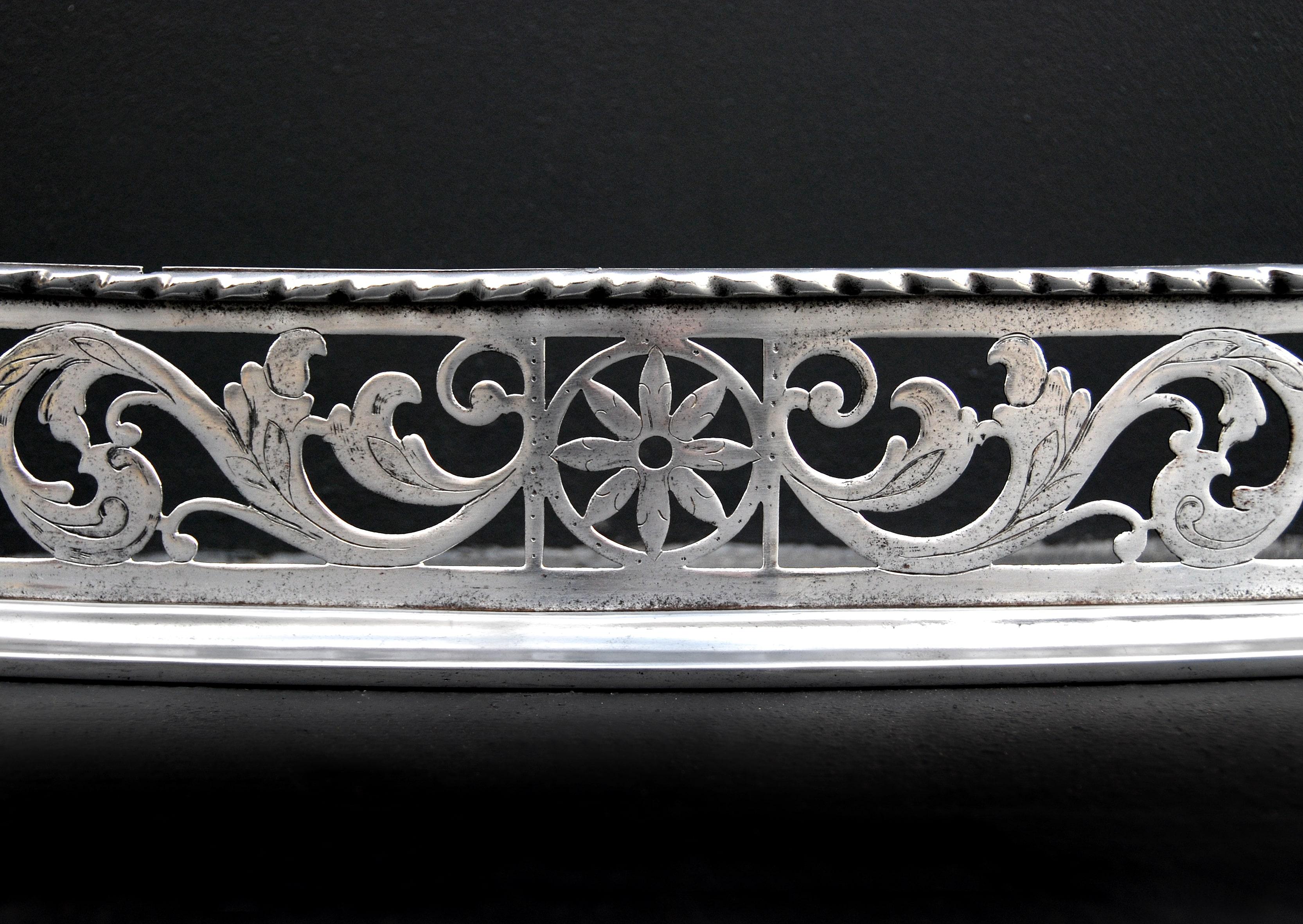 A fine quality 19th century steel fender with leaf and scroll work fret and knowled top moulding. Stamped: 